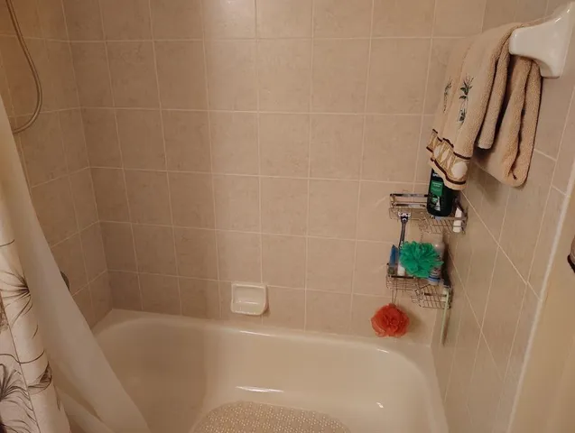 a view of entryway with paintings on the wall