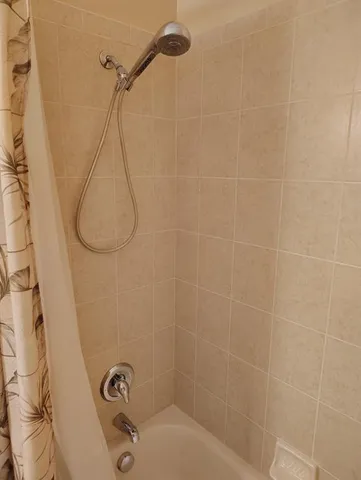 a bathroom with a sink toilet and a mirror