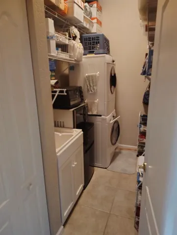 a view of a porch with furniture and floor to ceiling window