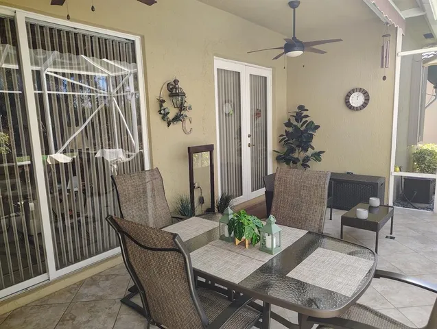 a view of backyard with seating space and trampoline
