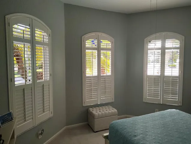 a bedroom with a bed and a couch