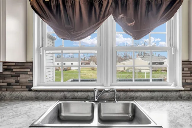a kitchen with a sink and a counter top space