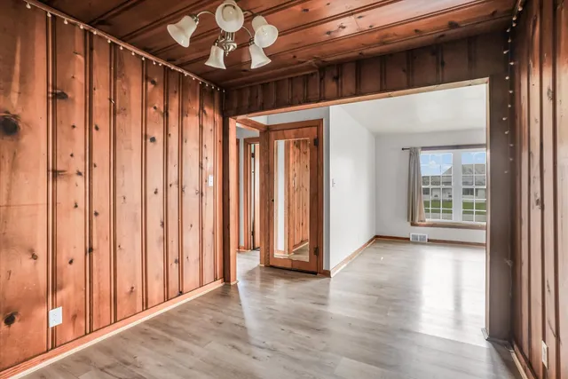 a view of a porch with wooden floor and stairs