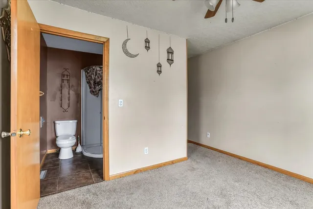 a view of a bathroom with a toilet