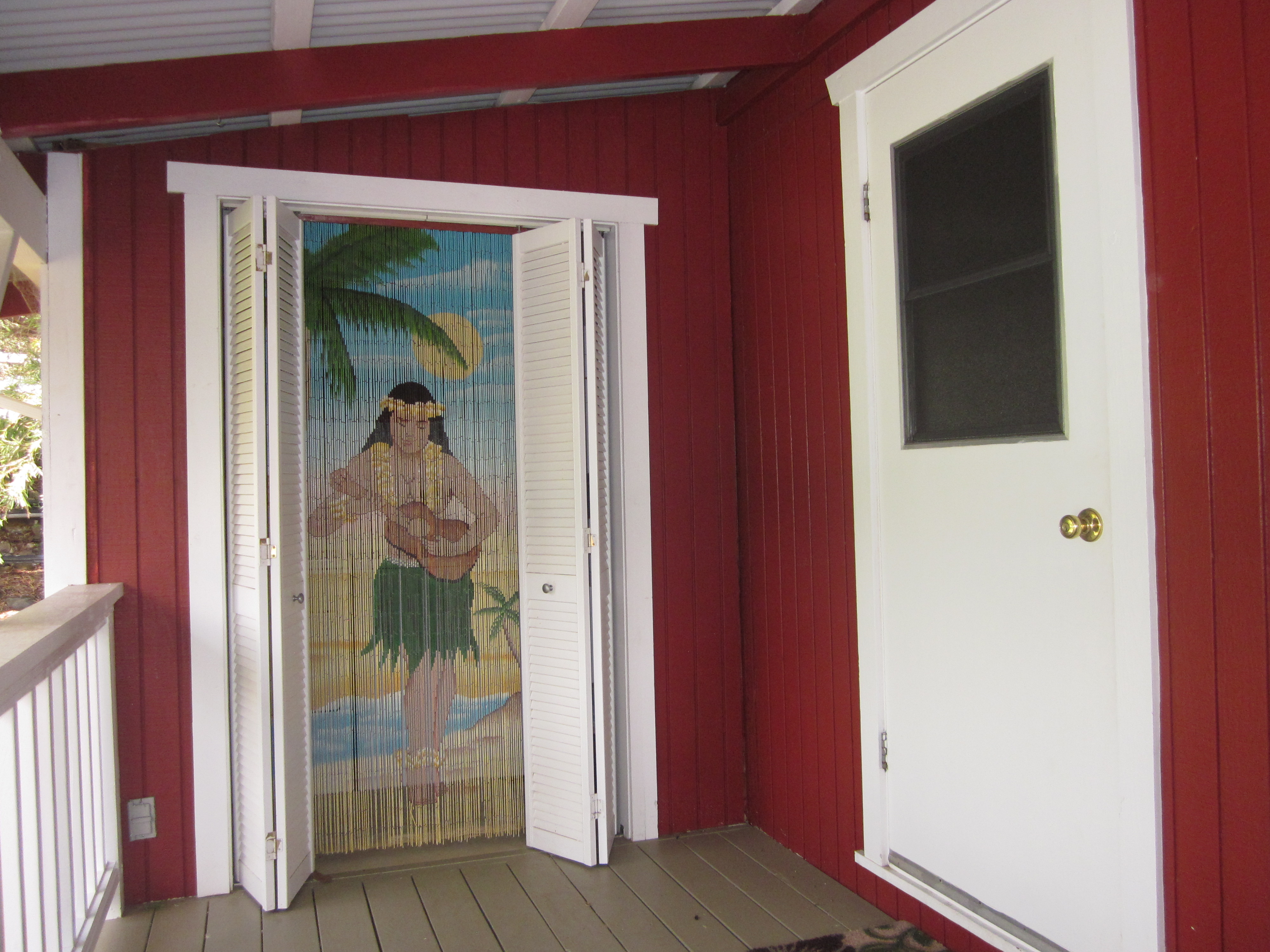66-1685 Kohala Mountain Road Kamuela, HI 96743 - Photo 21 of 26 a view of a hallway with wooden floor and dining room