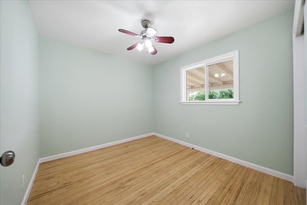 2509 Ganzan Way Rancho Cordova, CA 95670 - Photo 14 of 33 wooden floor in an empty room with a window