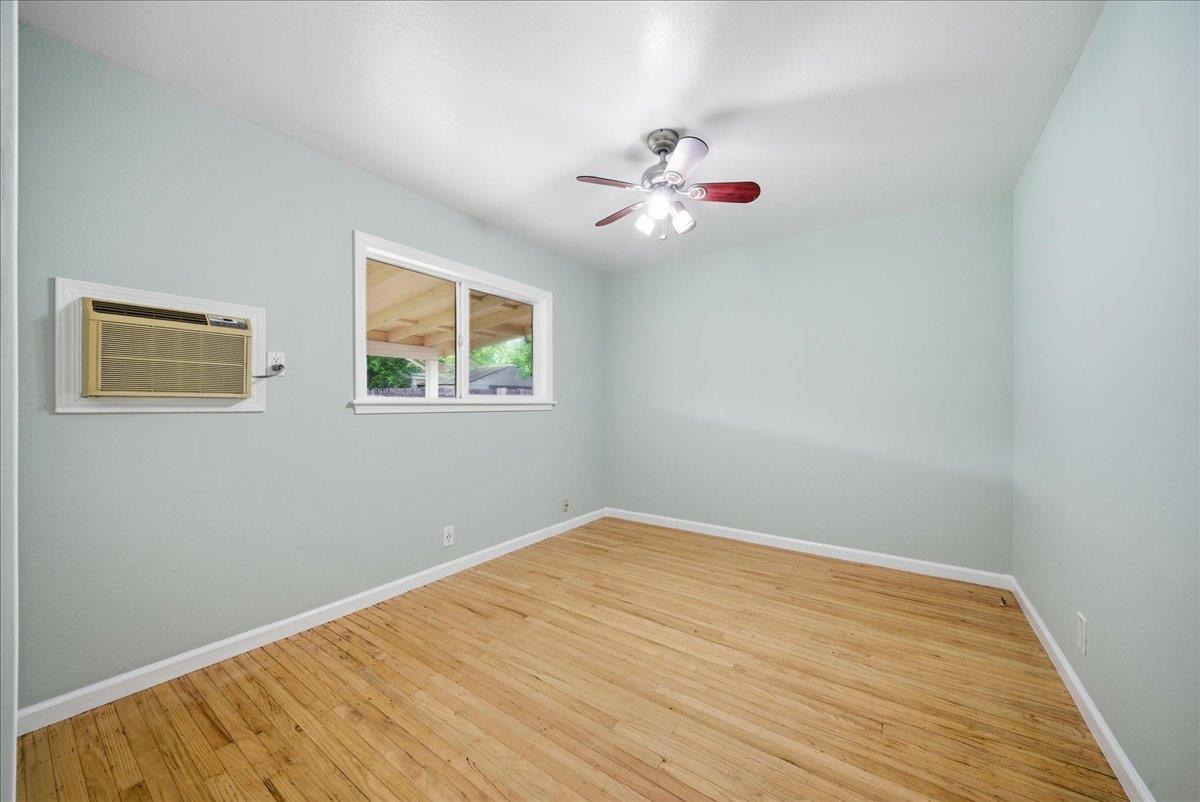 2509 Ganzan Way Rancho Cordova, CA 95670 - Photo 15 of 33 a view of an empty room with wooden floor and a window