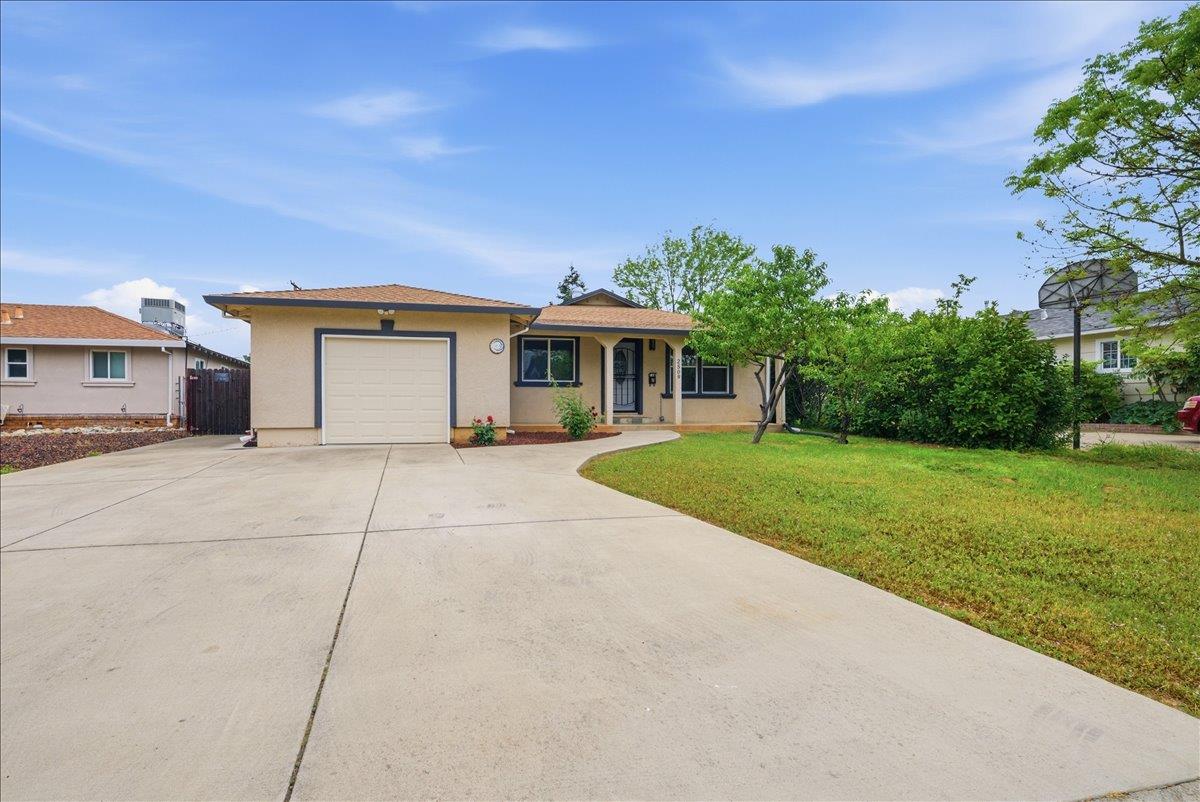 2509 Ganzan Way Rancho Cordova, CA 95670 - Photo 2 of 33 a front view of house with yard and green space