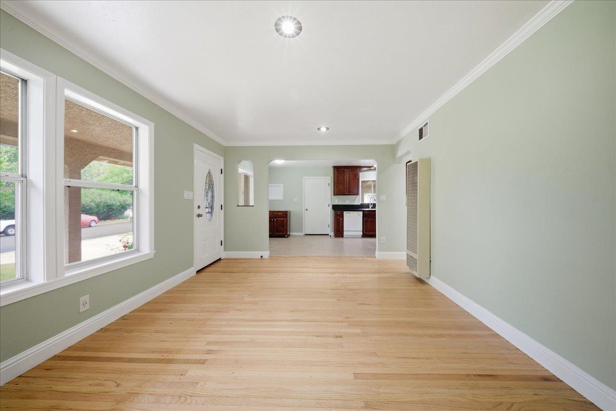 2509 Ganzan Way Rancho Cordova, CA 95670 - Photo 6 of 33 a view of empty room with wooden floor and a window