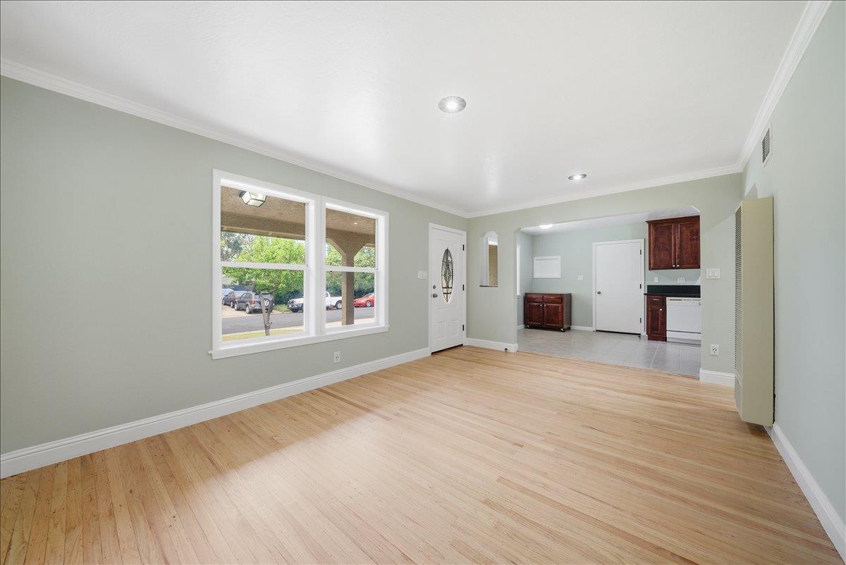 2509 Ganzan Way Rancho Cordova, CA 95670 - Photo 7 of 33 a view of empty room with wooden floor and fan