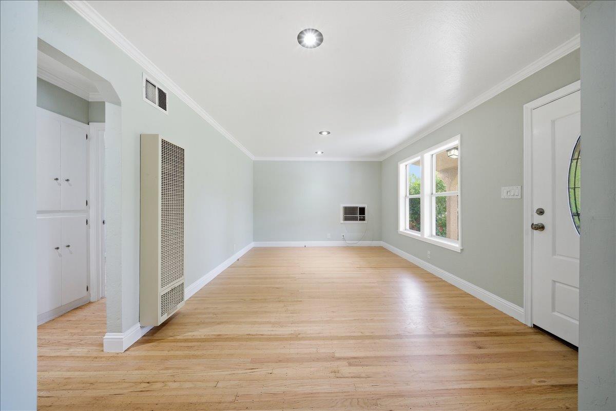 2509 Ganzan Way Rancho Cordova, CA 95670 - Photo 8 of 33 a view of an empty room with wooden floor and a window