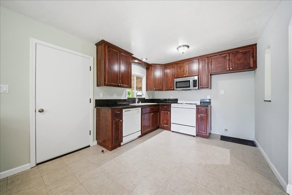 2509 Ganzan Way Rancho Cordova, CA 95670 - Photo 9 of 33 a kitchen with stainless steel appliances a refrigerator and a sink