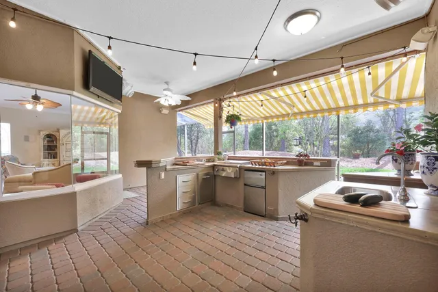 a kitchen with sink cabinets and wooden floor