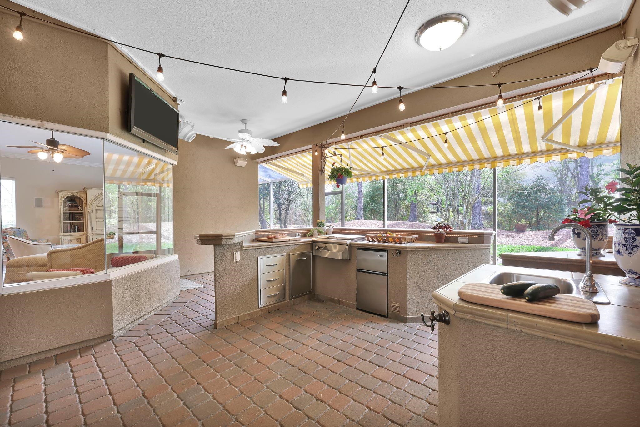 a kitchen with sink cabinets and wooden floor