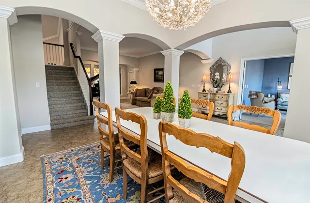 a large kitchen with stainless steel appliances granite countertop a lot of counter space and wooden floors