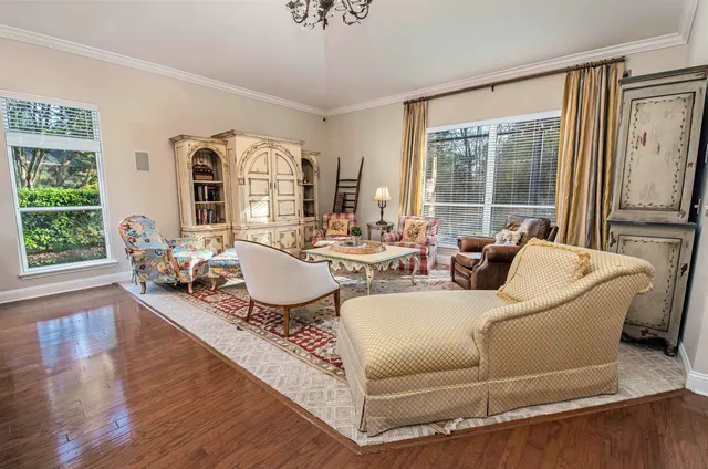 a spacious bedroom with a bed and a large window