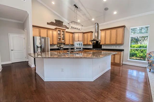 a bedroom with a bed and ceiling fan