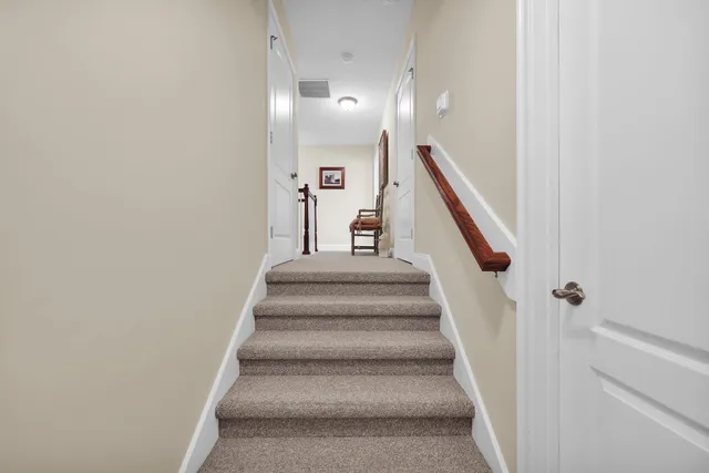 a spacious bedroom with a bed and a walk in closet