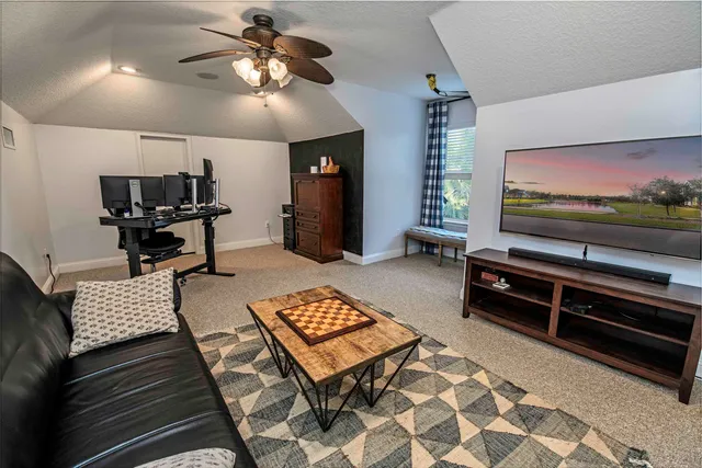 a kitchen with a table chairs and a chandelier