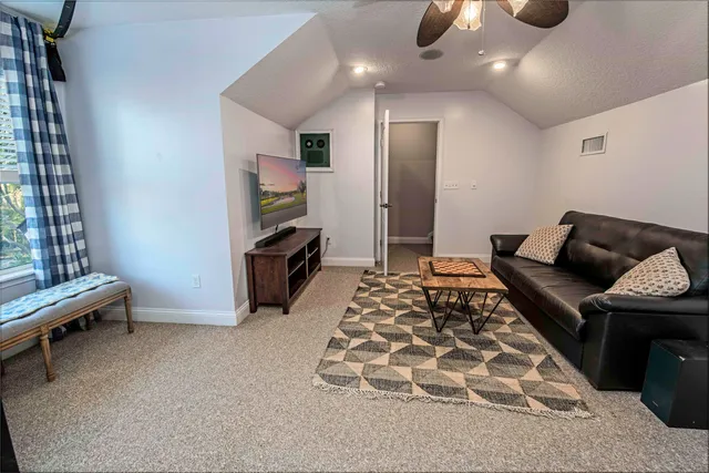 a view of a patio with table and chairs
