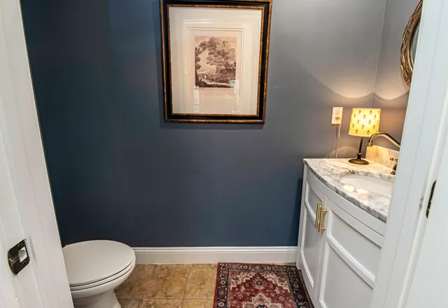 a view of a house with a yard patio and fire pit