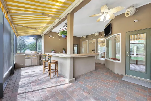 a view of a swimming pool with a patio