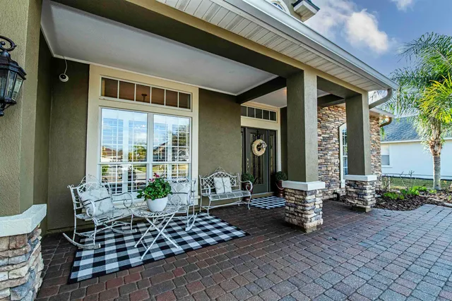 a view of a entryway with furniture and floor to ceiling window