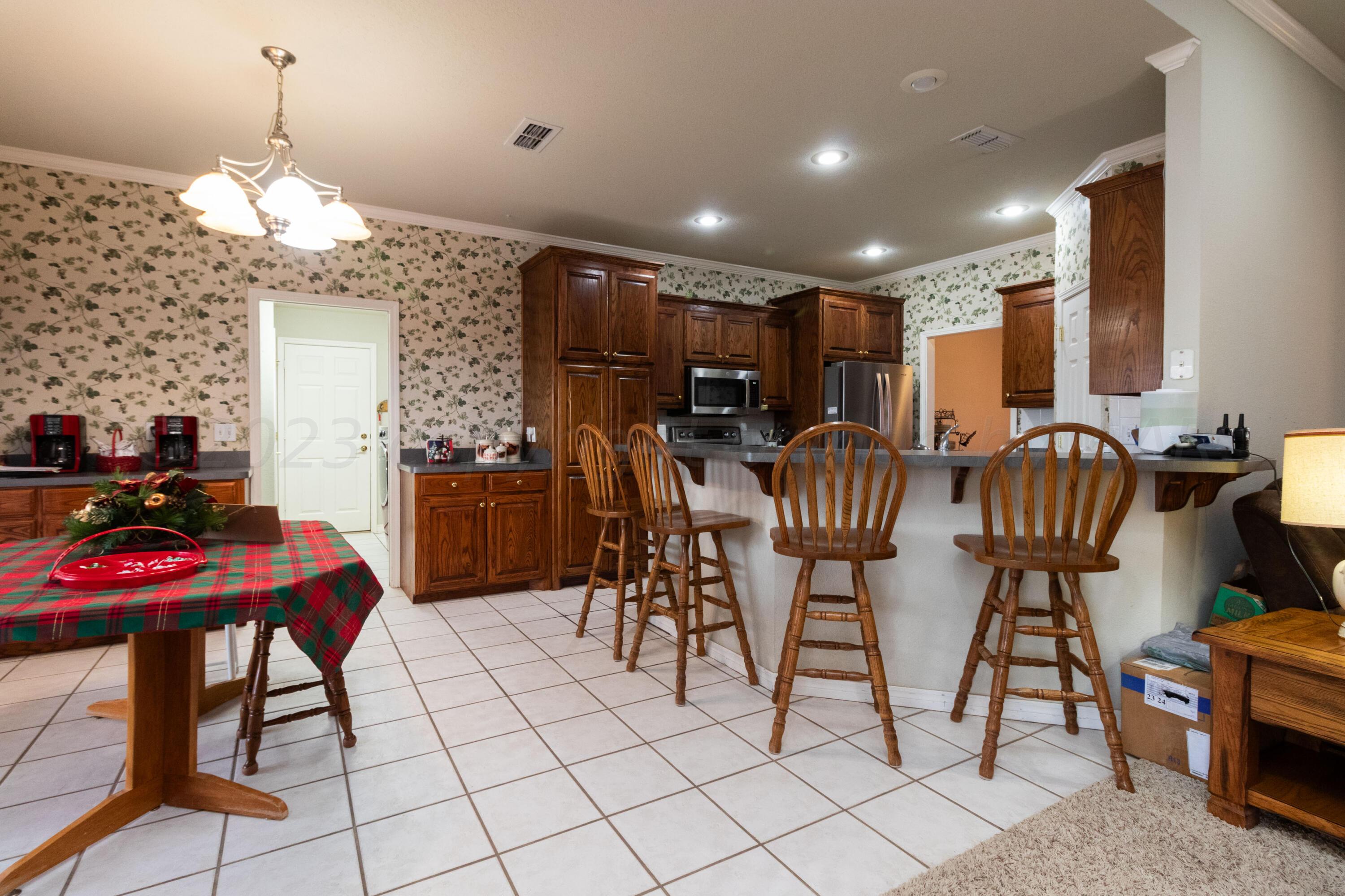 15212 Halsey Trail Amarillo, TX 79118 - Photo 12 of 47 a view of a dining room with furniture