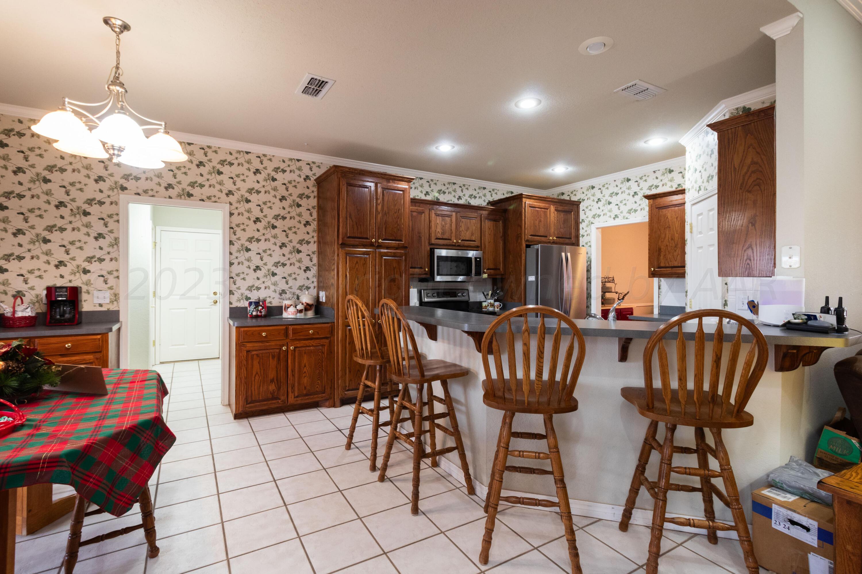 15212 Halsey Trail Amarillo, TX 79118 - Photo 19 of 47 a view of a dining room with furniture