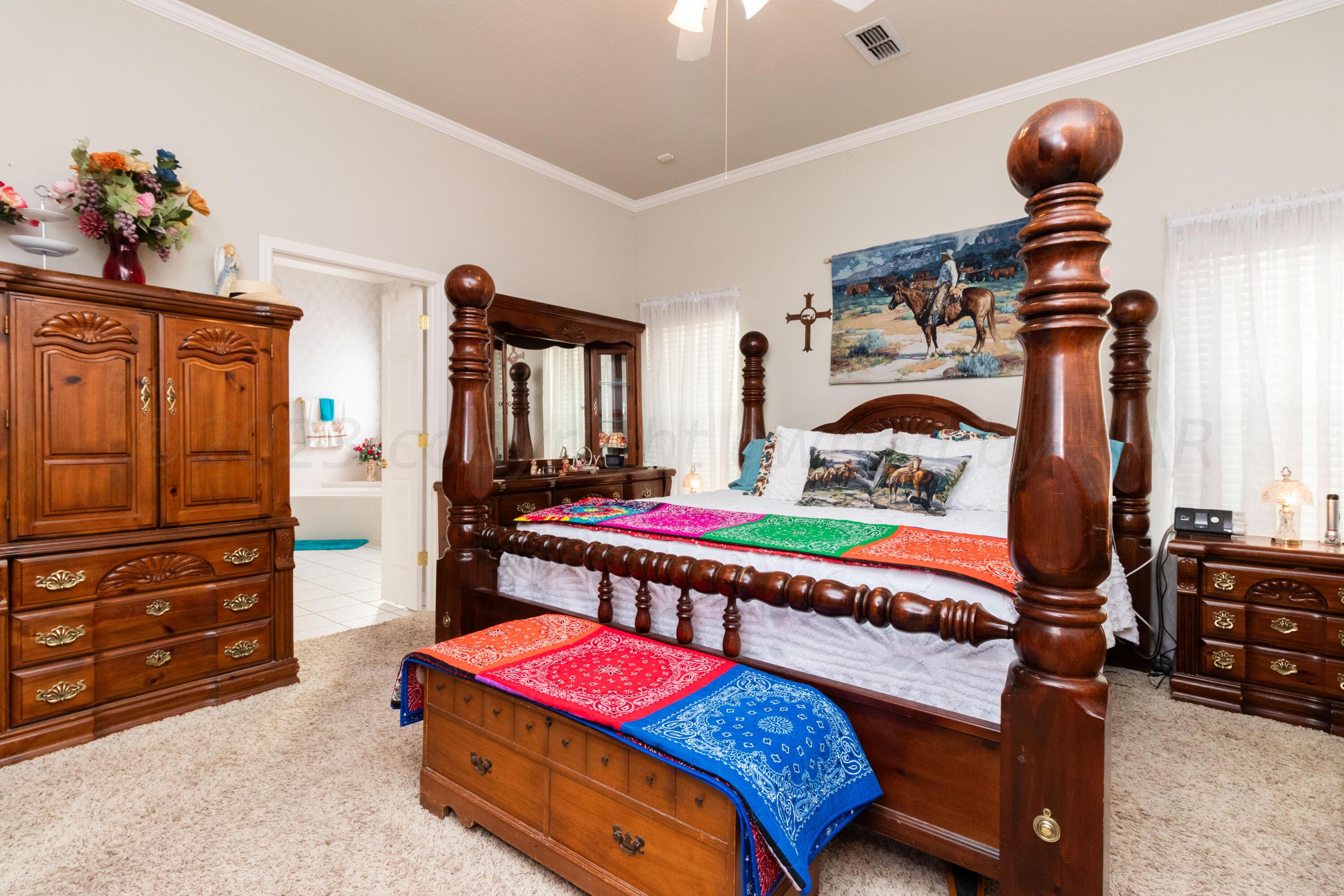 15212 Halsey Trail Amarillo, TX 79118 - Photo 28 of 47 a bedroom with a bed and wooden floor