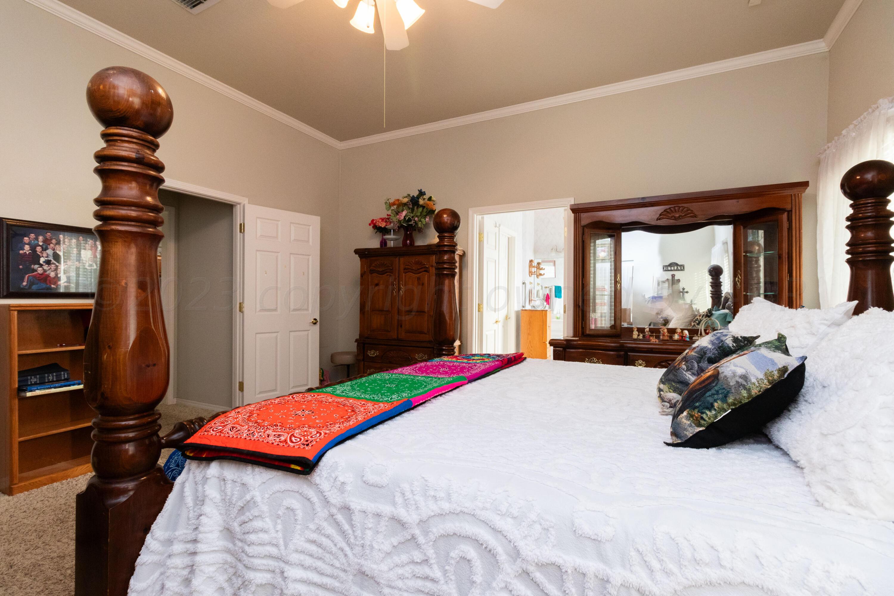 15212 Halsey Trail Amarillo, TX 79118 - Photo 29 of 47 a bedroom with bed and large windows