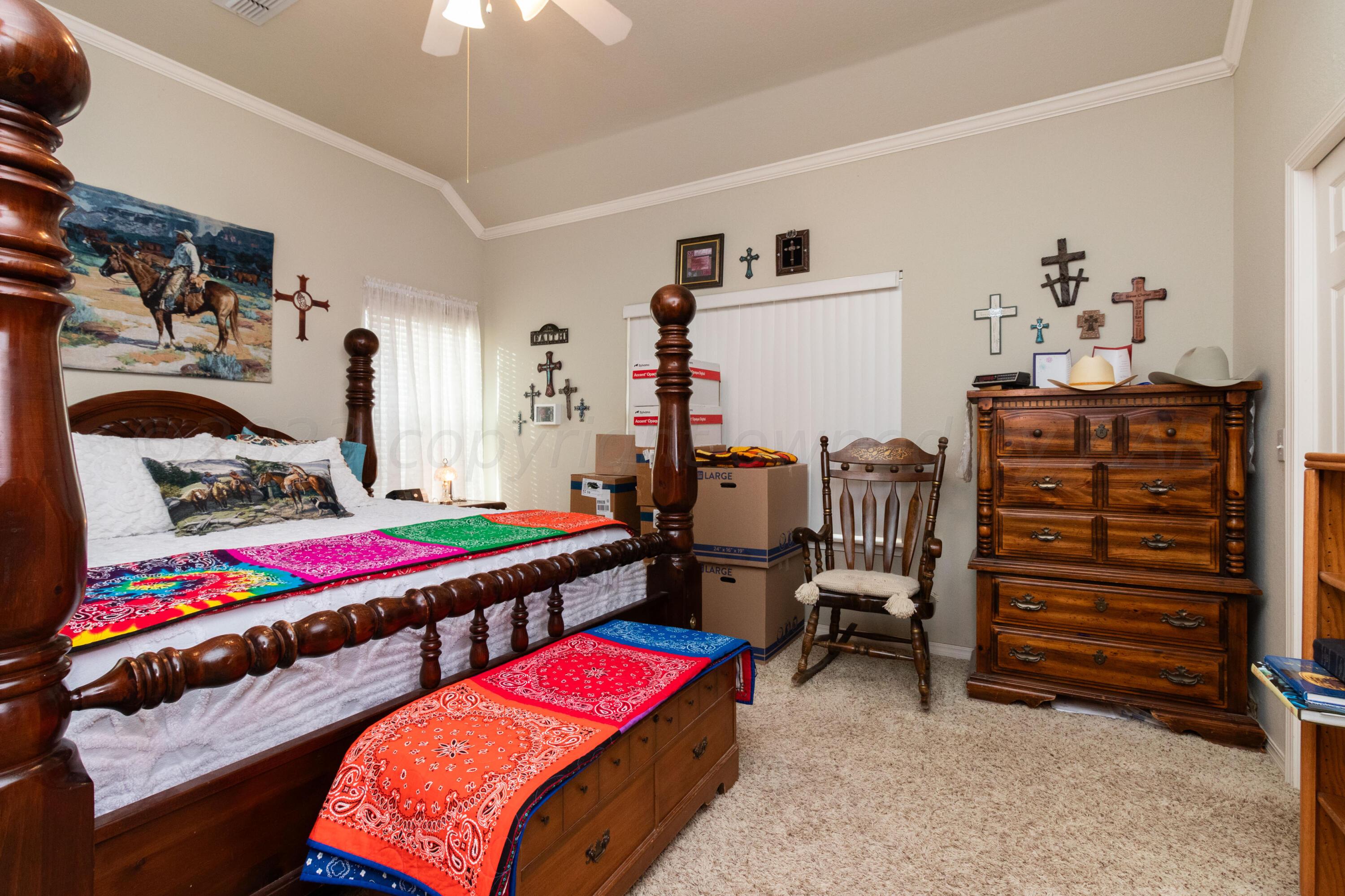 15212 Halsey Trail Amarillo, TX 79118 - Photo 30 of 47 a bedroom with furniture and paintings on the wall