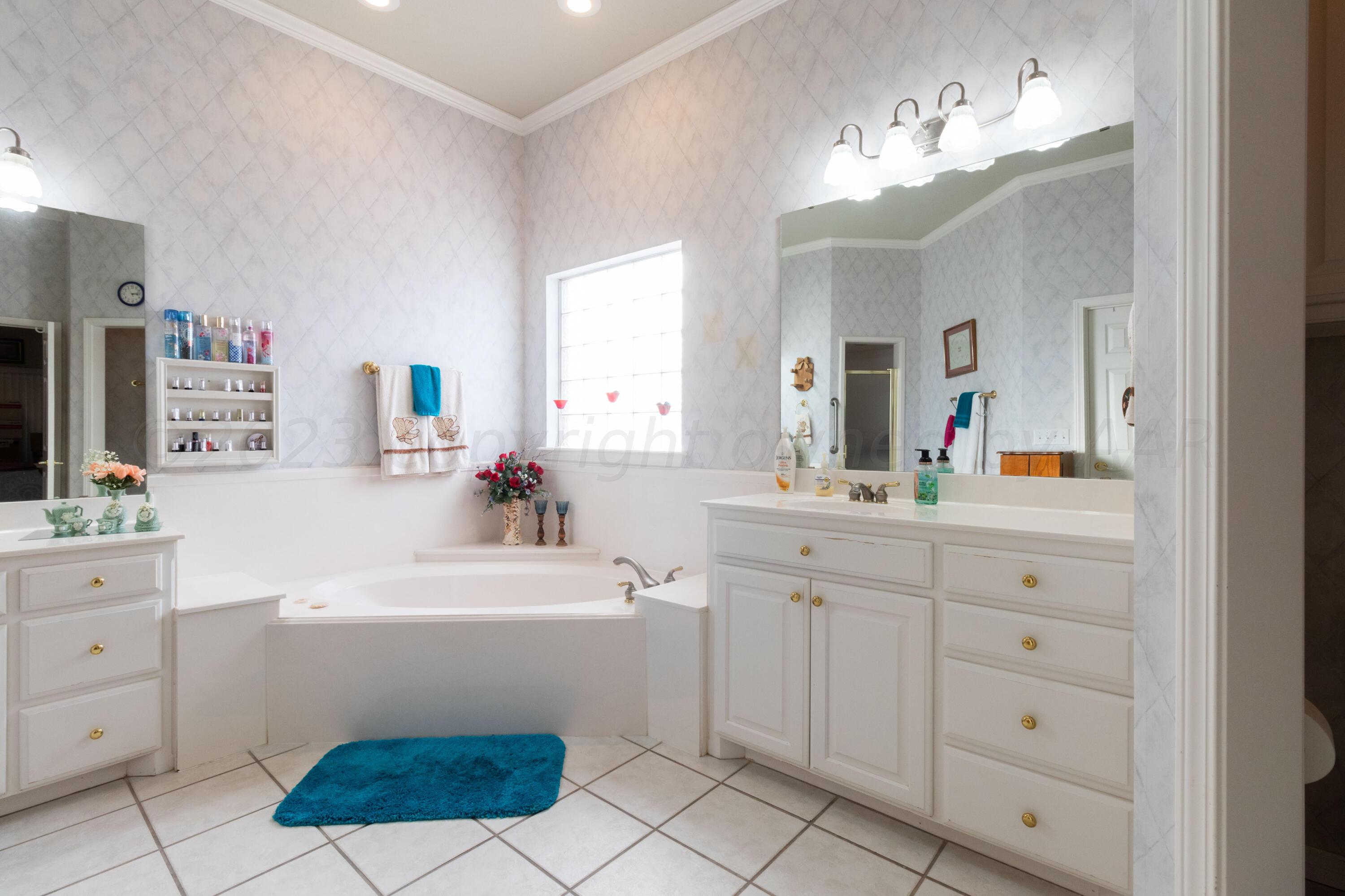 15212 Halsey Trail Amarillo, TX 79118 - Photo 33 of 47 a bathroom with a sink a vanity and mirror