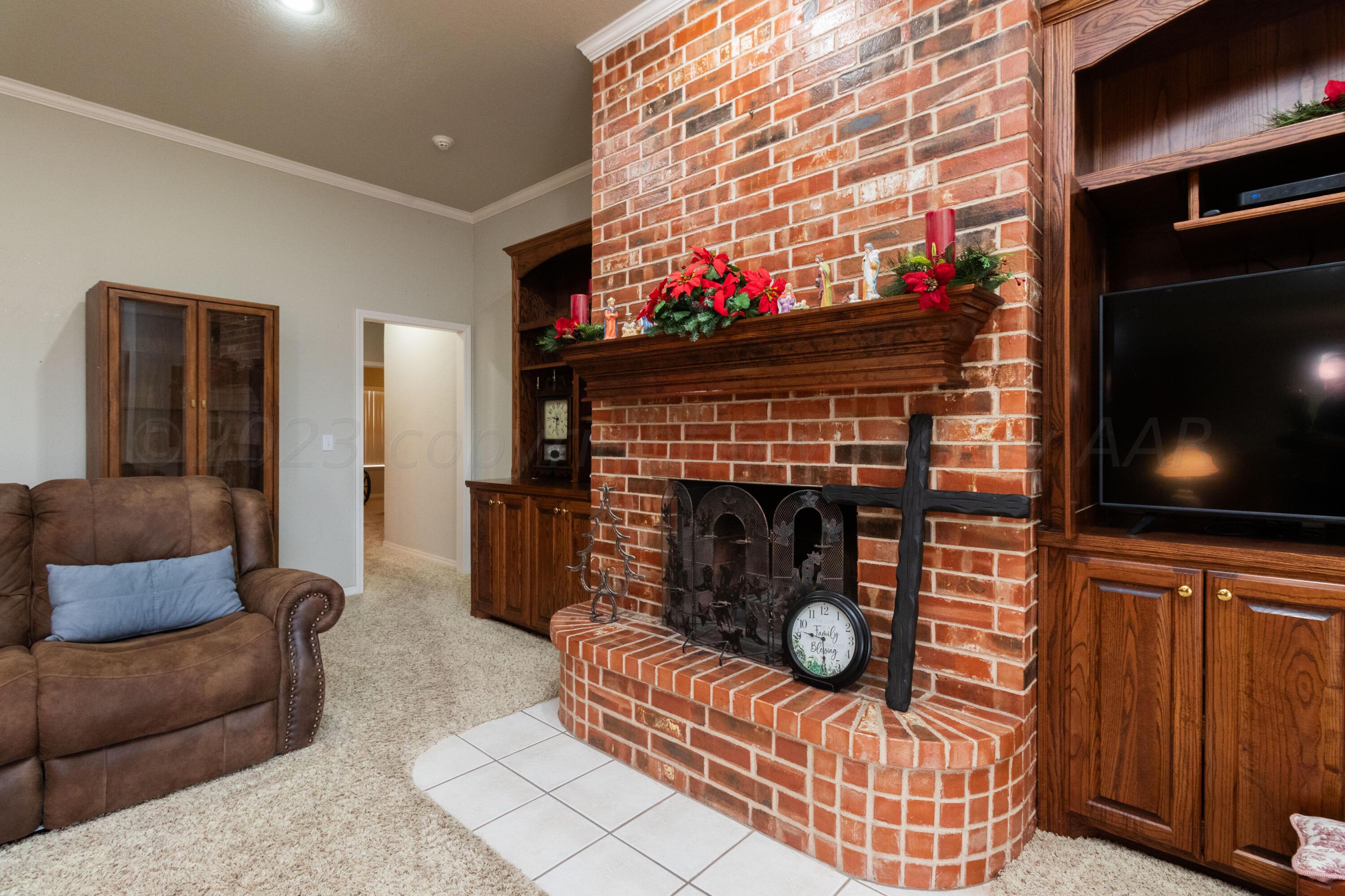 15212 Halsey Trail Amarillo, TX 79118 - Photo 10 of 47 a living room with furniture and a fireplace