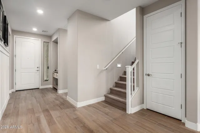 a view of entryway with wooden floor