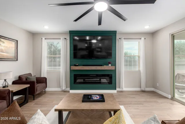 a living room with furniture and a fireplace