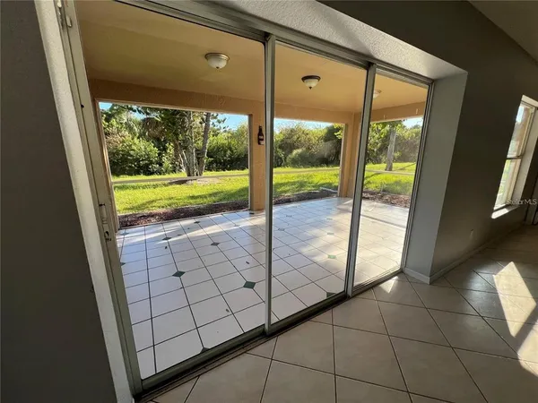a view of a floor to ceiling window and an outdoor view