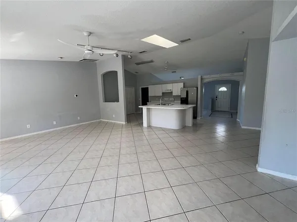 a view of a kitchen with a sink and cabinets