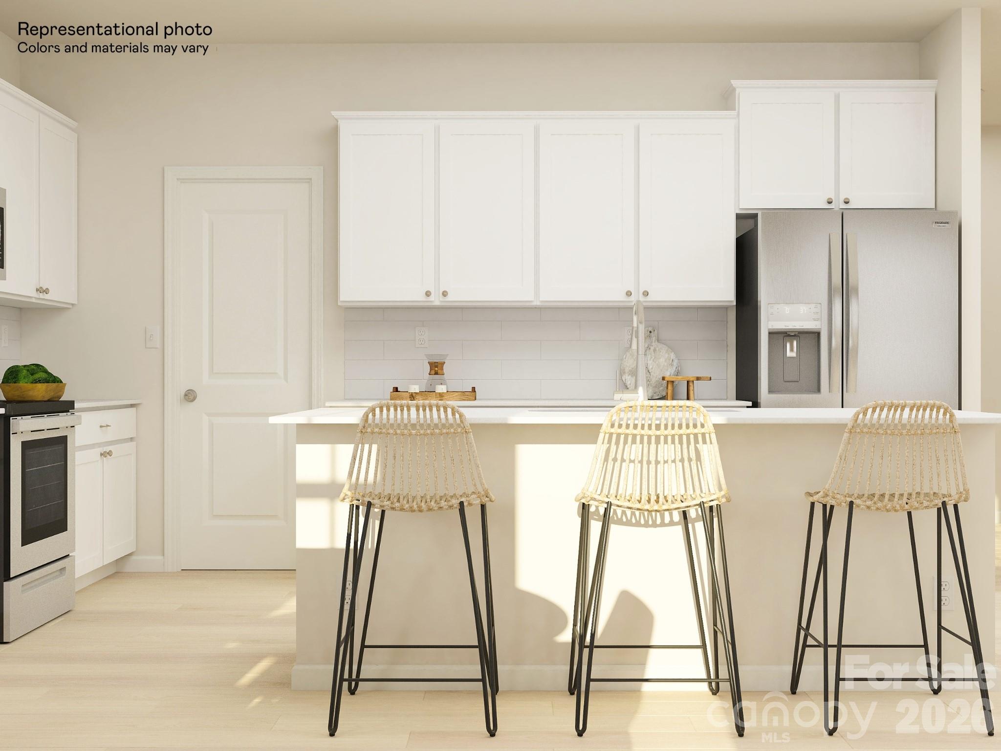 7032 Juneberry Way Maiden, NC 28650 - Photo 15 of 25 a kitchen with a sink a refrigerator and white cabinets