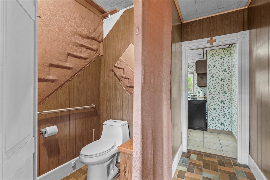 75 Grove Street Lynn, MA 01905 - Photo 13 of 38 a bathroom with a toilet and a shower