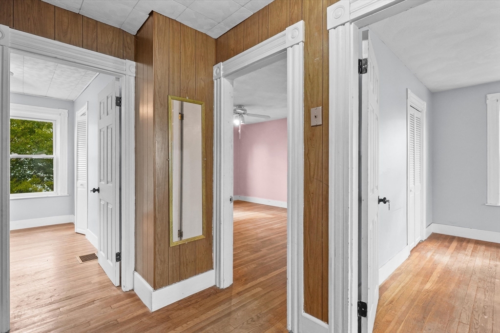 75 Grove Street Lynn, MA 01905 - Photo 14 of 38 a view of a hallway with wooden floor