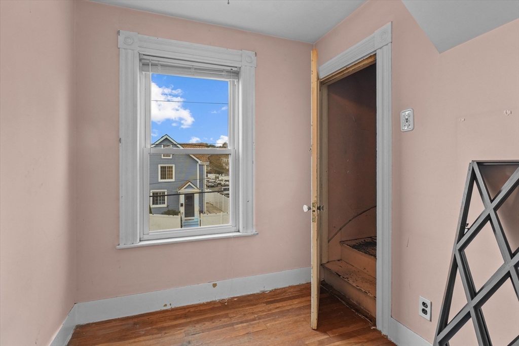 75 Grove Street Lynn, MA 01905 - Photo 20 of 38 a view of front door and bedroom
