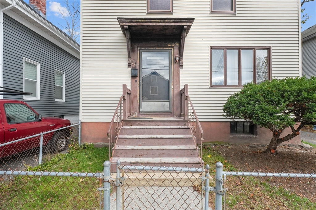 75 Grove Street Lynn, MA 01905 - Photo 2 of 38 a view of a house with a yard