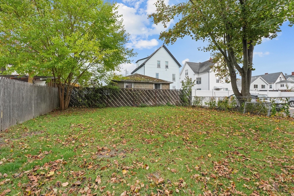 75 Grove Street Lynn, MA 01905 - Photo 27 of 38 a front view of a house with garden