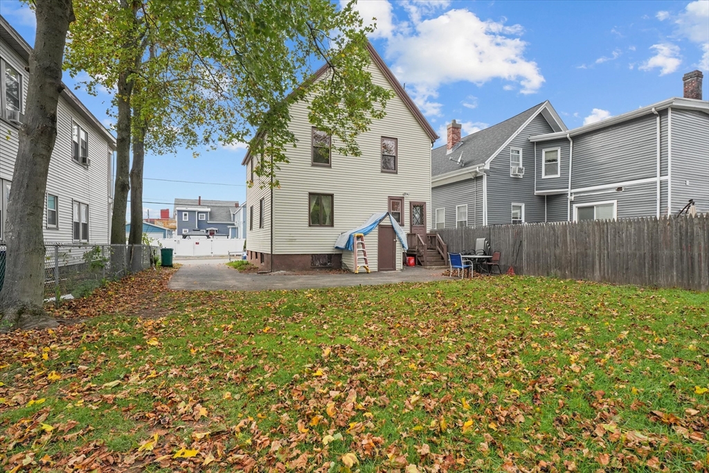 75 Grove Street Lynn, MA 01905 - Photo 28 of 38 a view of a house with a yard