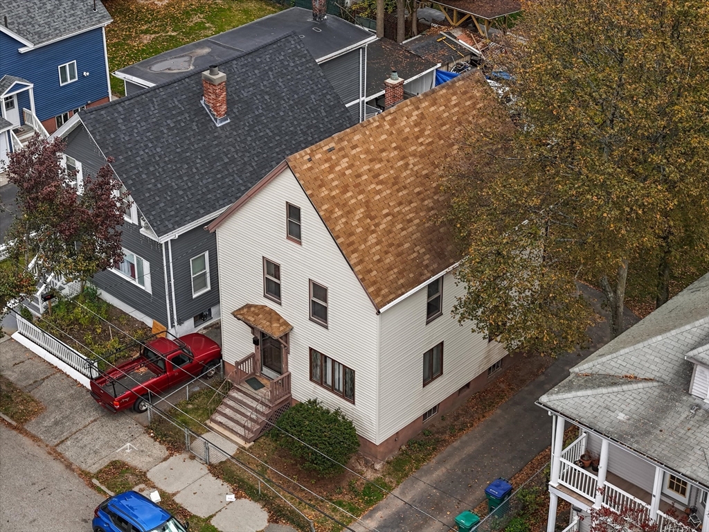 75 Grove Street Lynn, MA 01905 - Photo 29 of 38 an aerial view of a house with large trees