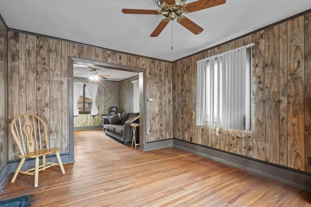 75 Grove Street Lynn, MA 01905 - Photo 3 of 38 wooden floor and windows in a room with a chandelier