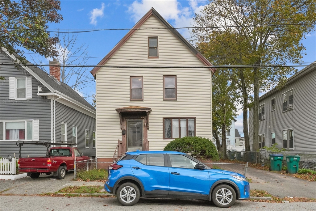 75 Grove Street Lynn, MA 01905 - Photo 36 of 38 a front view of a house with parking space