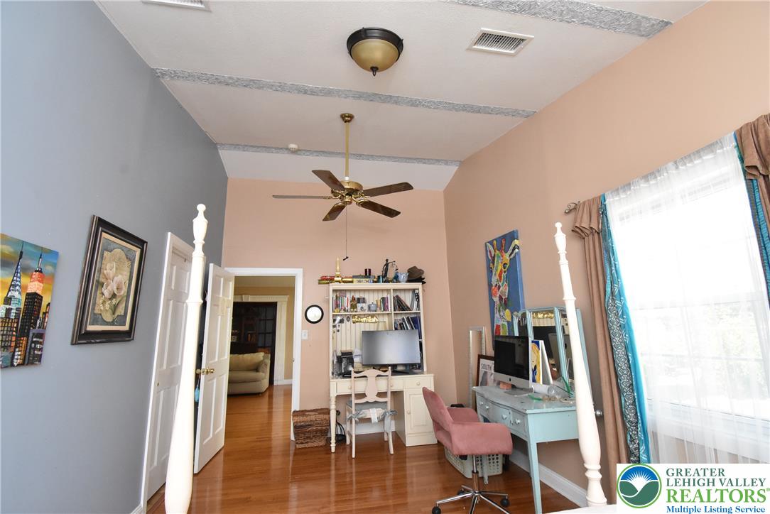 424 Grape Street Whitehall, PA 18052 - Photo 43 of 56 This spacious bedroom features elegant vaulted ceilings and classic hardwood flooring.