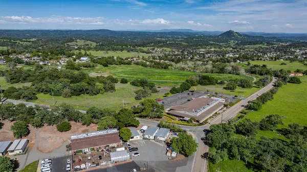 an aerial view of a house with a garden